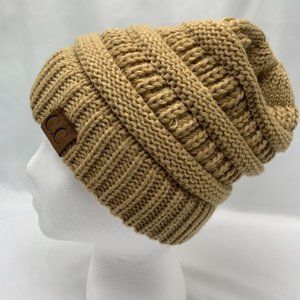 Tan/camel colored C.C beanie with ponytail hole